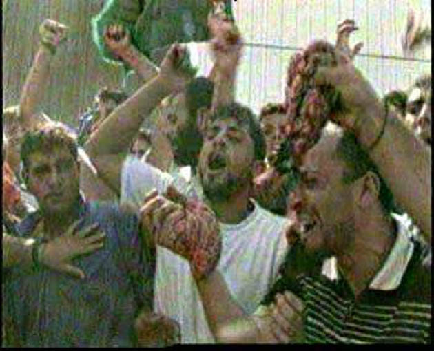 arabs.waving.entrails.butchered.israelis.ramallah.jpg